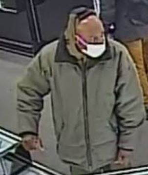 subject in green jacket