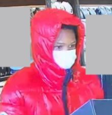 Subjects wanted after displaying gun during robbery