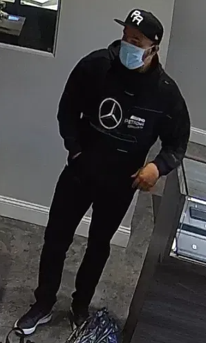 Robbery subject wearing black clothing.